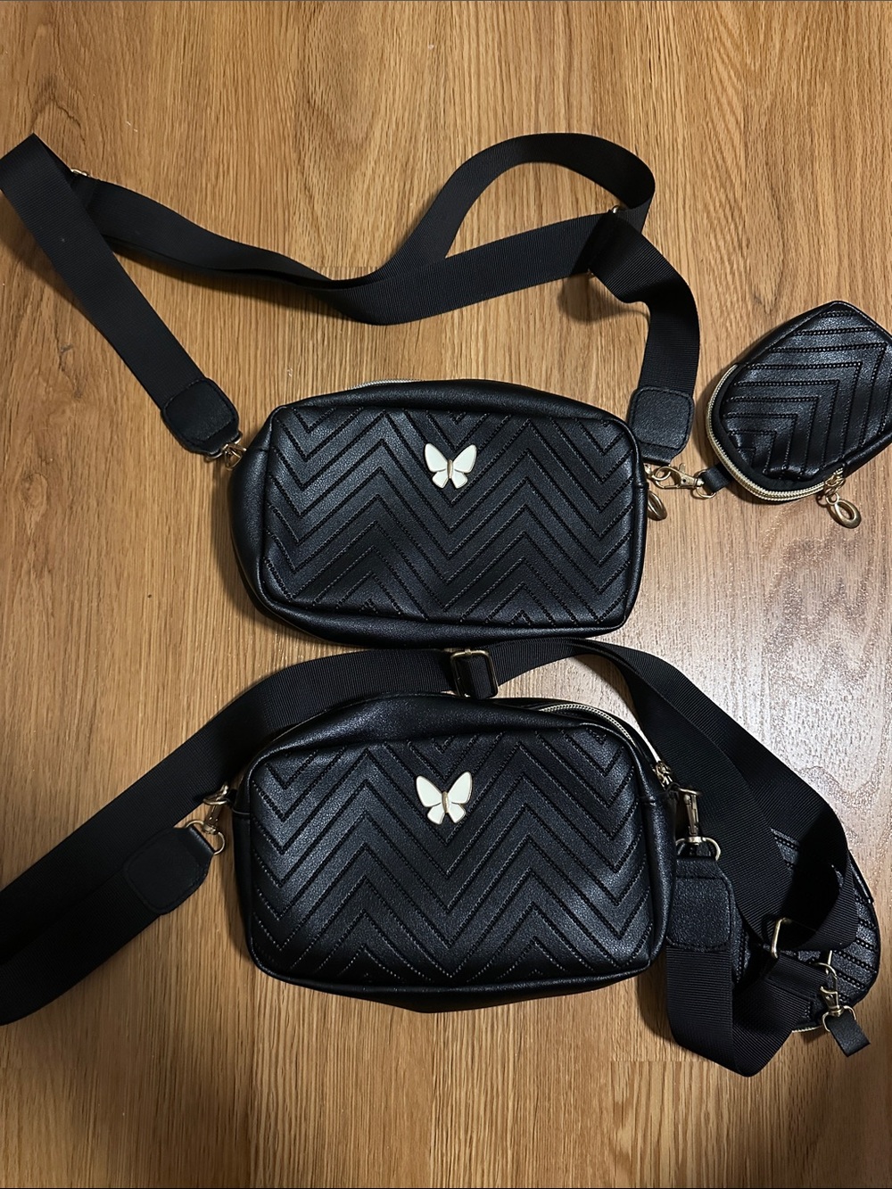 Black Quilted Crossbody Bag with Gold Butterfly Accent